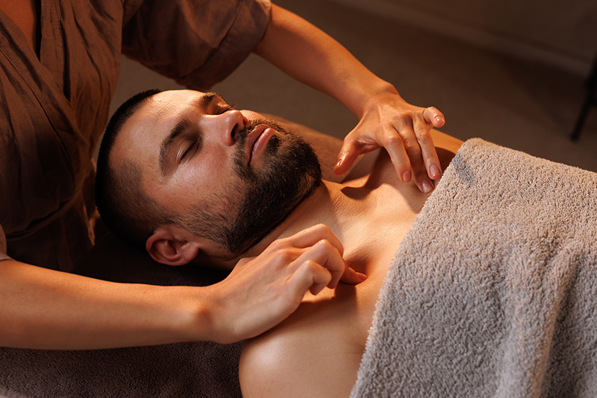 Man receiving a relaxing chest massage at spa