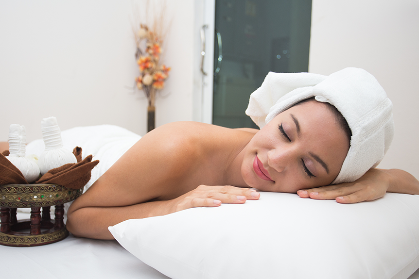 Woman feeling sleepy after a relaxing reflexology session
