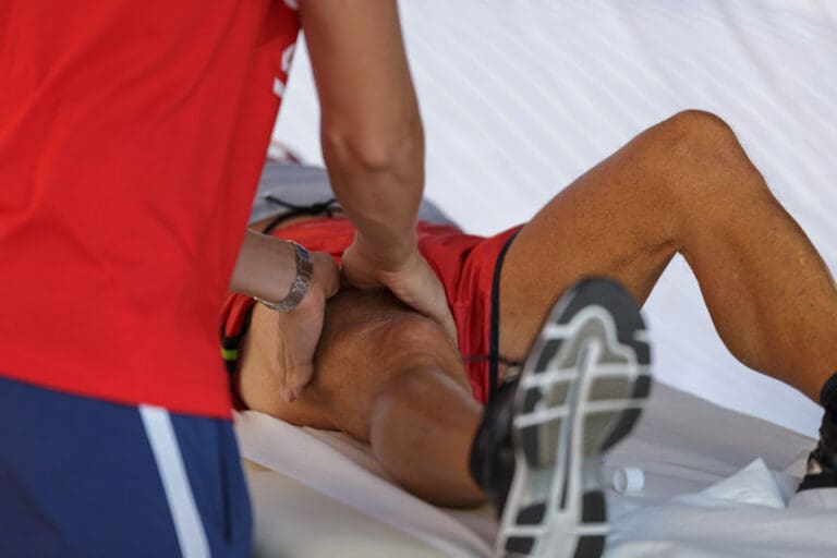 cyclist receive leg massage