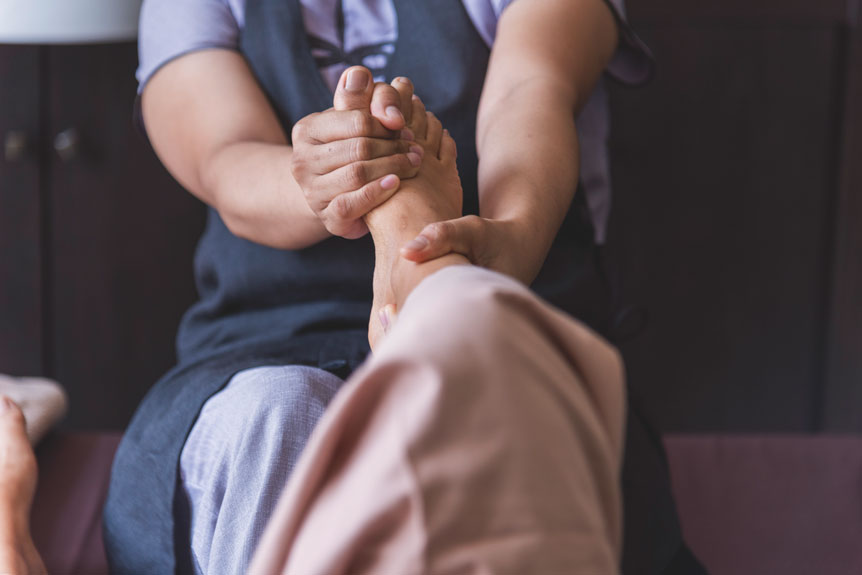 massage thai spa foot massage close up woman leg