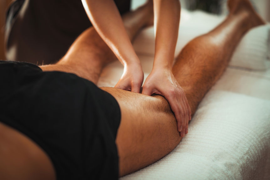 receiving a leg massage for muscular recovery